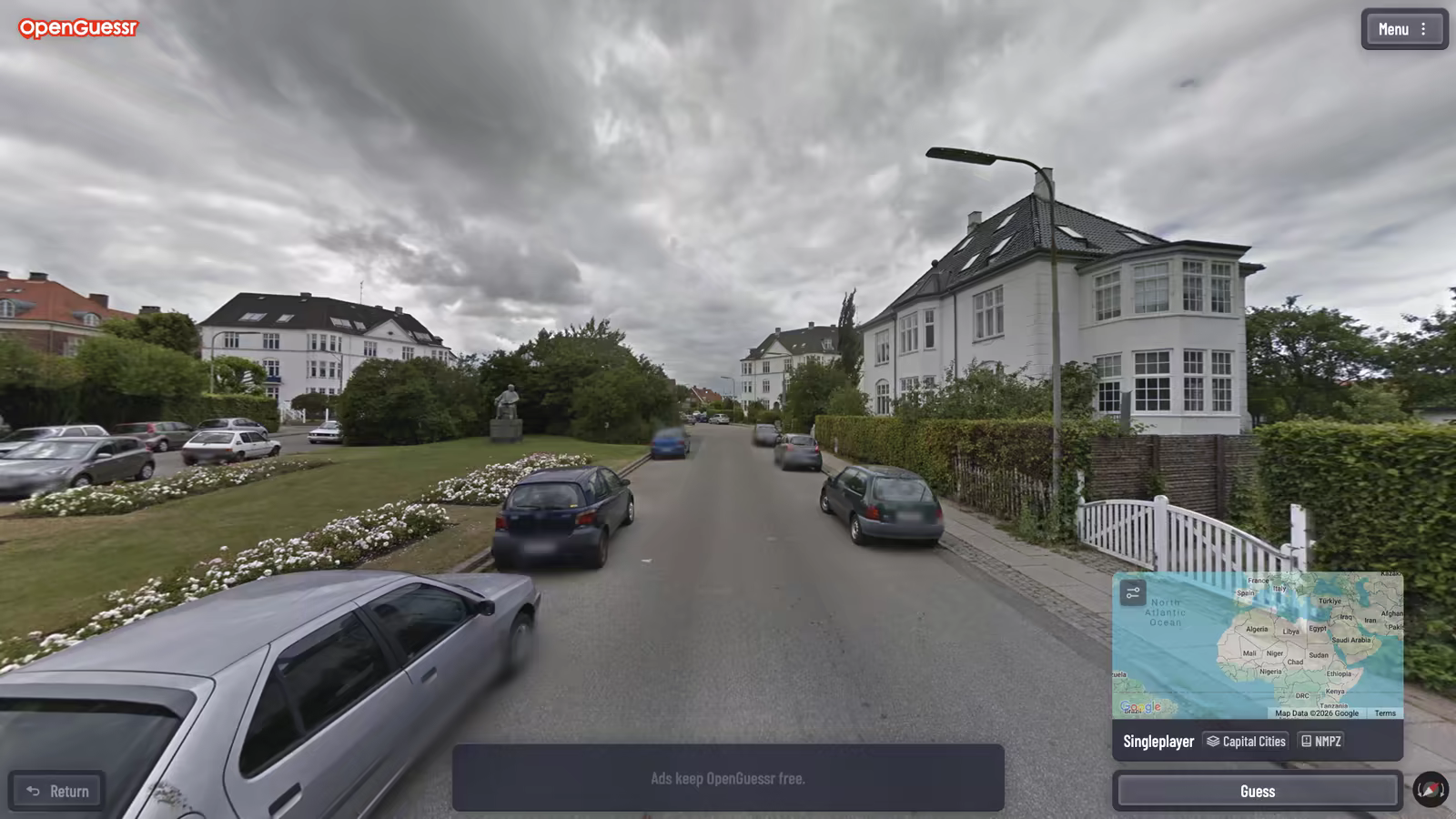 An OpenGuessr NMPZ round on a residential street in a capital city